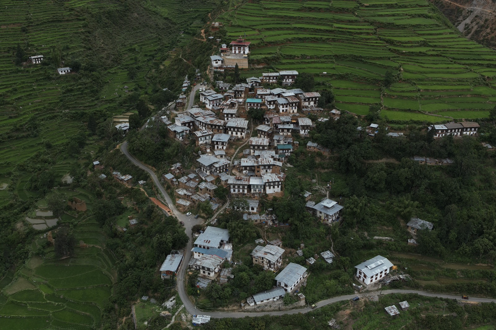 Aerial view of Drinchengang village nestled in green terraced hills