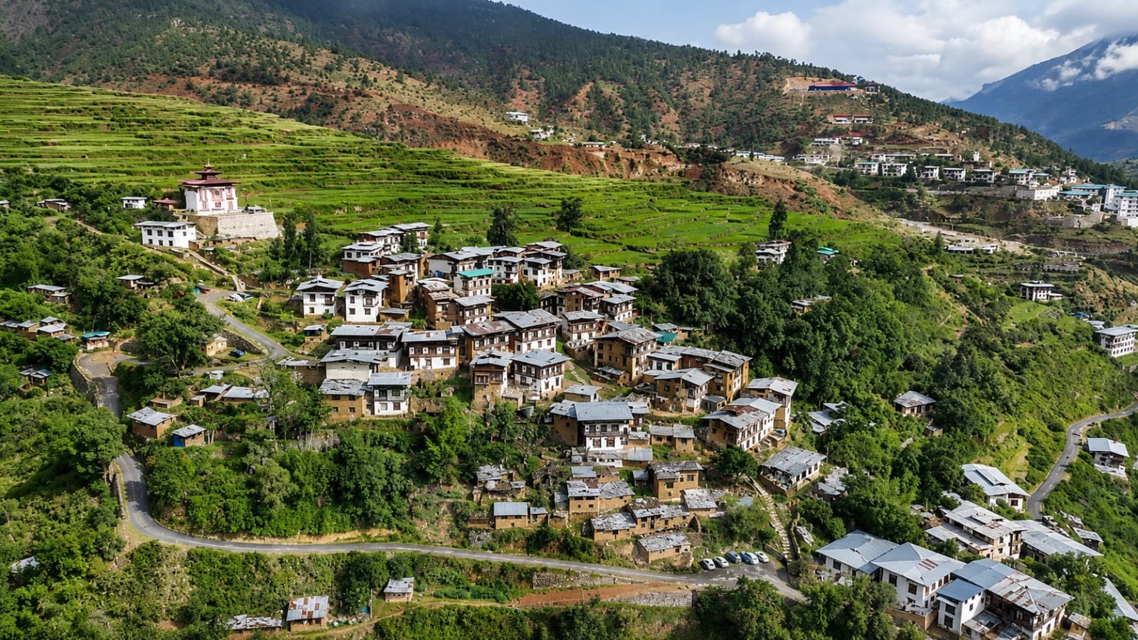 Aerial view of Drinchengang village nestled in green terraced hills